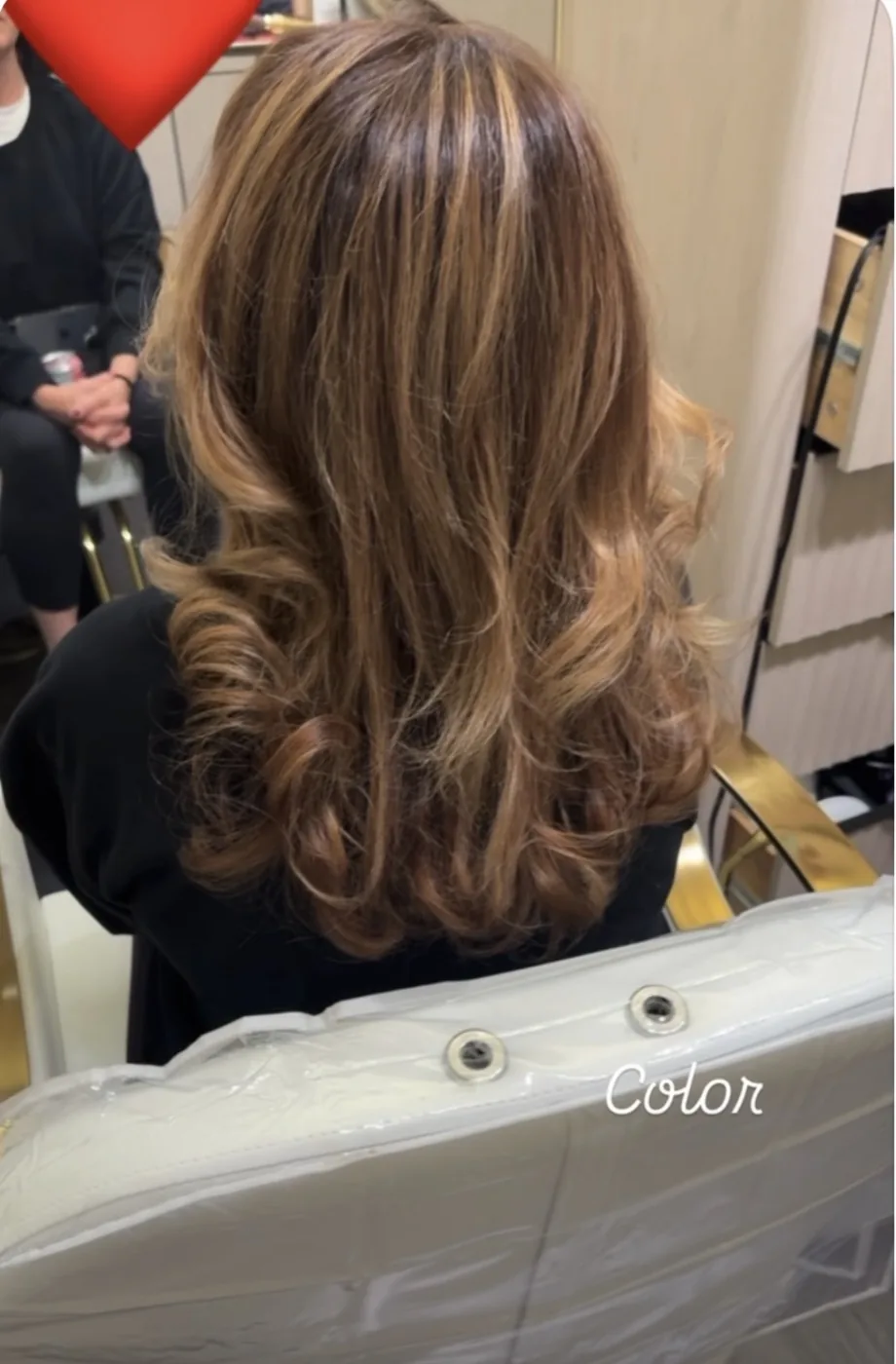 Honey highlights curled into soft voluminous ringlets